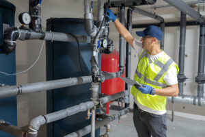 Man Checking pipes in indrustry