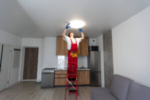 Expert technician fix ceiling light